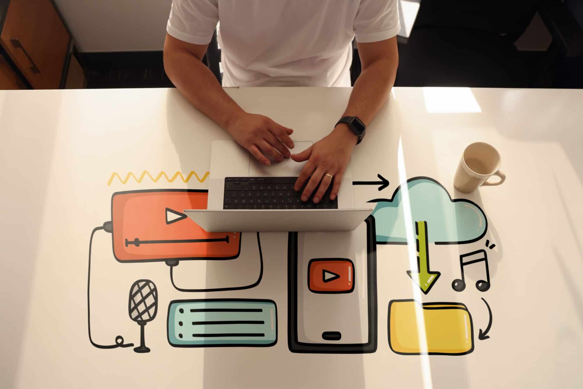 A man on a laptop.
