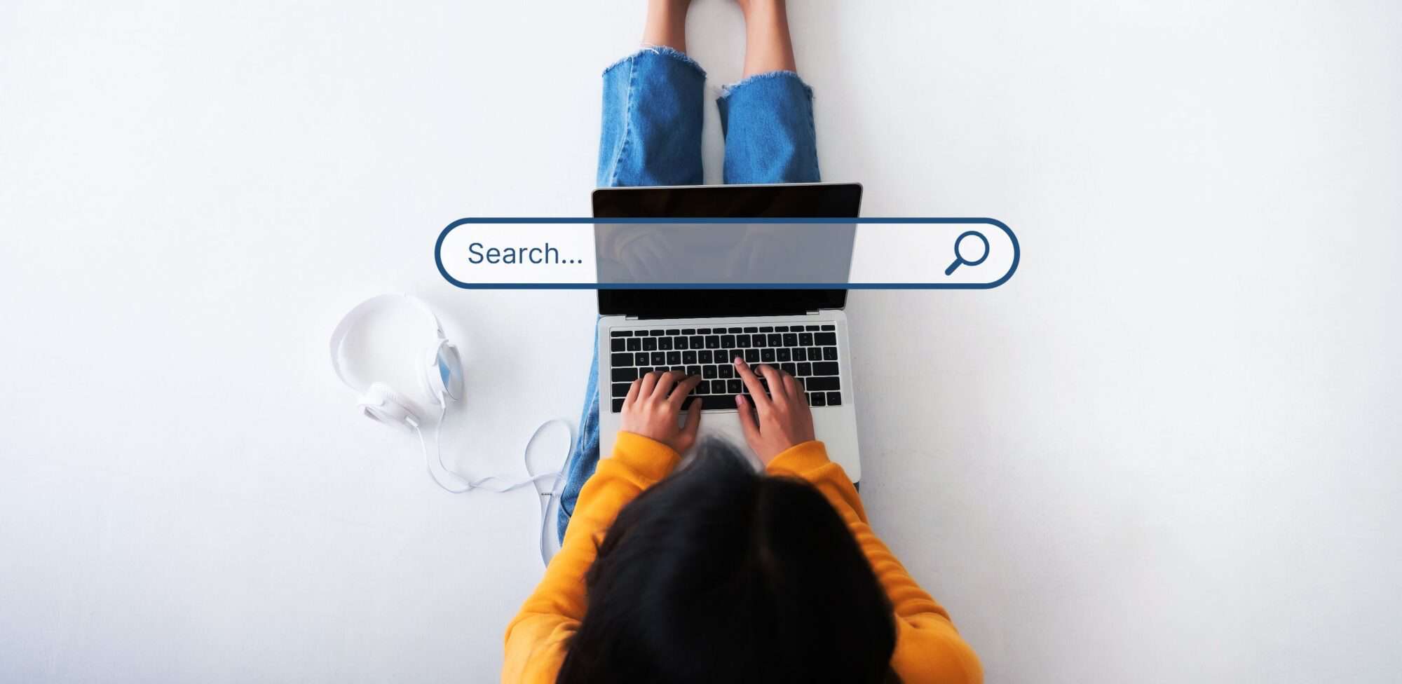 A woman searching Google one her laptop.
