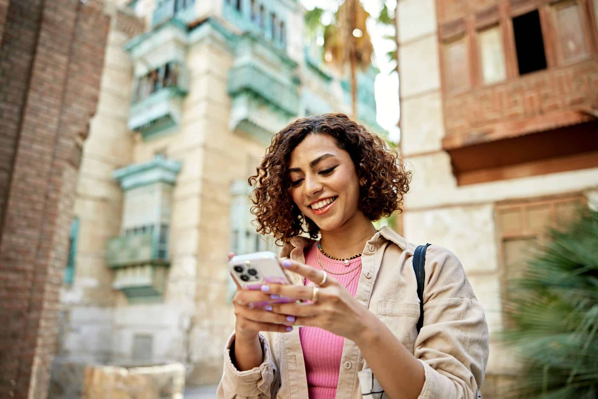 A woman searching the web on her smart phone.